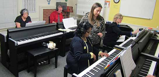 Senior adults in piano class