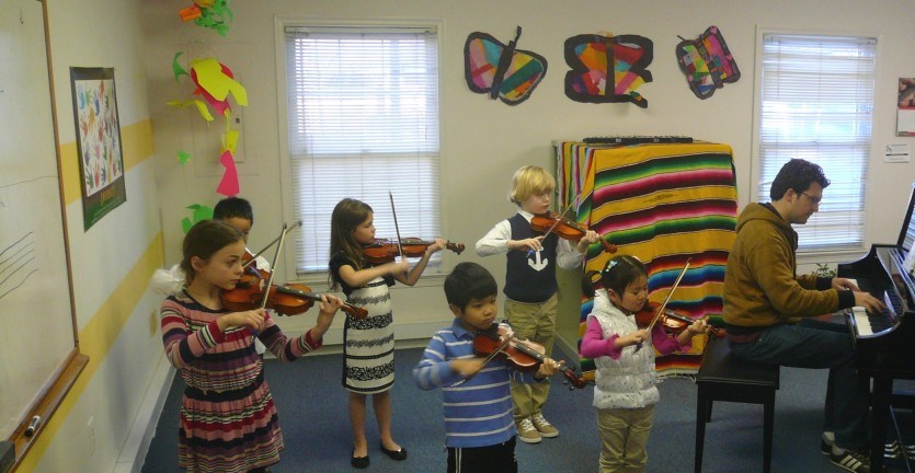 Violin class students performing