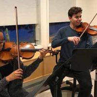 Chamber music students rehearsing