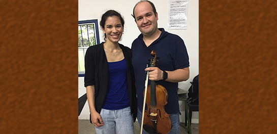 Claire with donated violin in Costa Rica