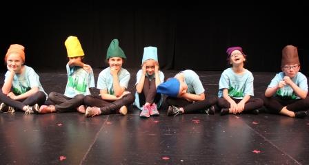 Kids on stage at summer acting camp