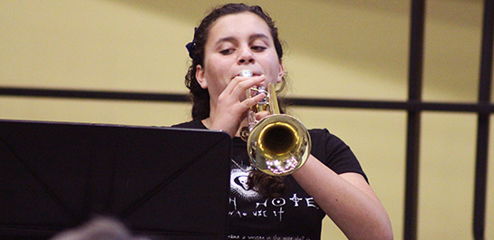 Girl playing trumpet at brass camp
