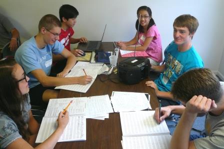 Young music composers working at summer camp