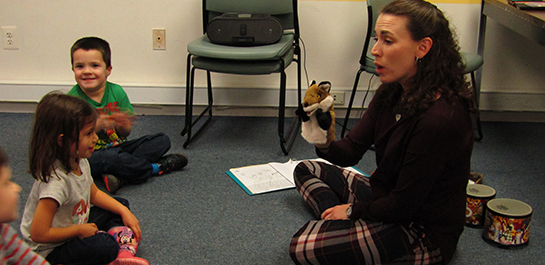Early childhood music class with puppet