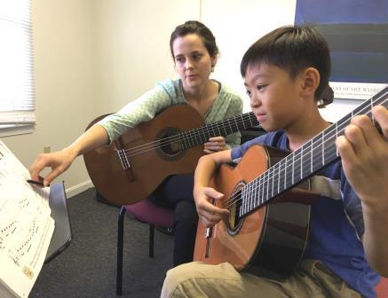 Guitar student in private lesson