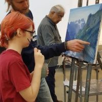 Art Teacher teaching adult painting class