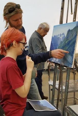 Art Teacher teaching adult painting class