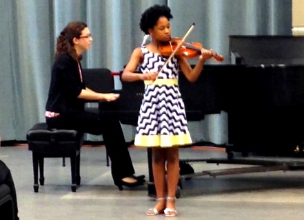 Violin student performing