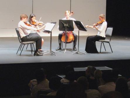 Students performing in Harris Theatre