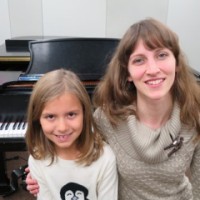 Piano student with instructor