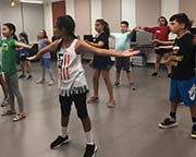Summer musical theater students rehearsing