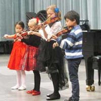 Violin students performing at recital