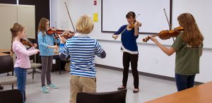 Violin students practicing