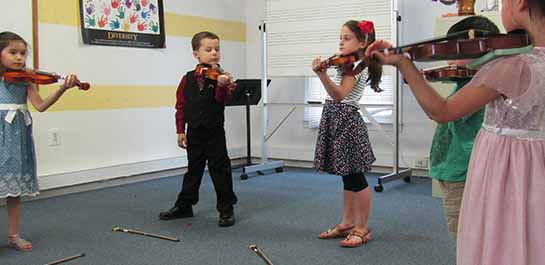 Violin students in class