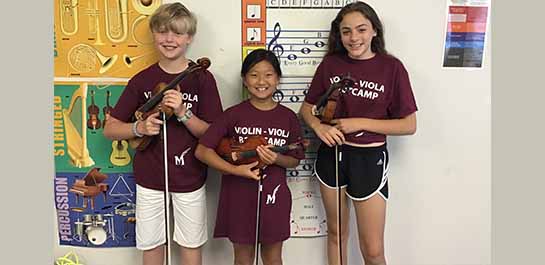 Violin students posing