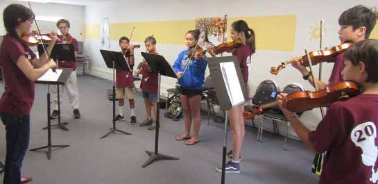 Students practicing at summer violin camp