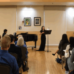 vocal teacher performing in front of an audience
