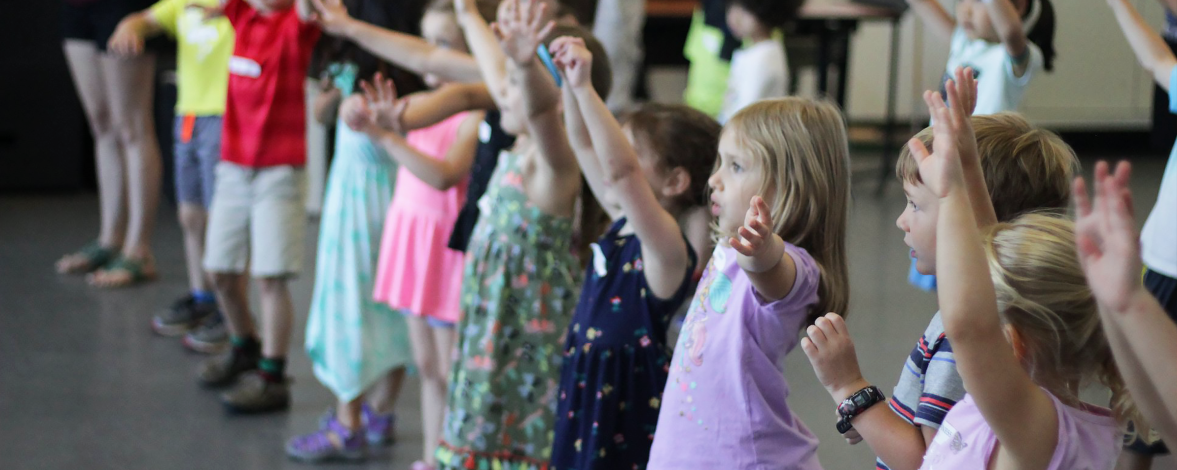 young children learning dance moves