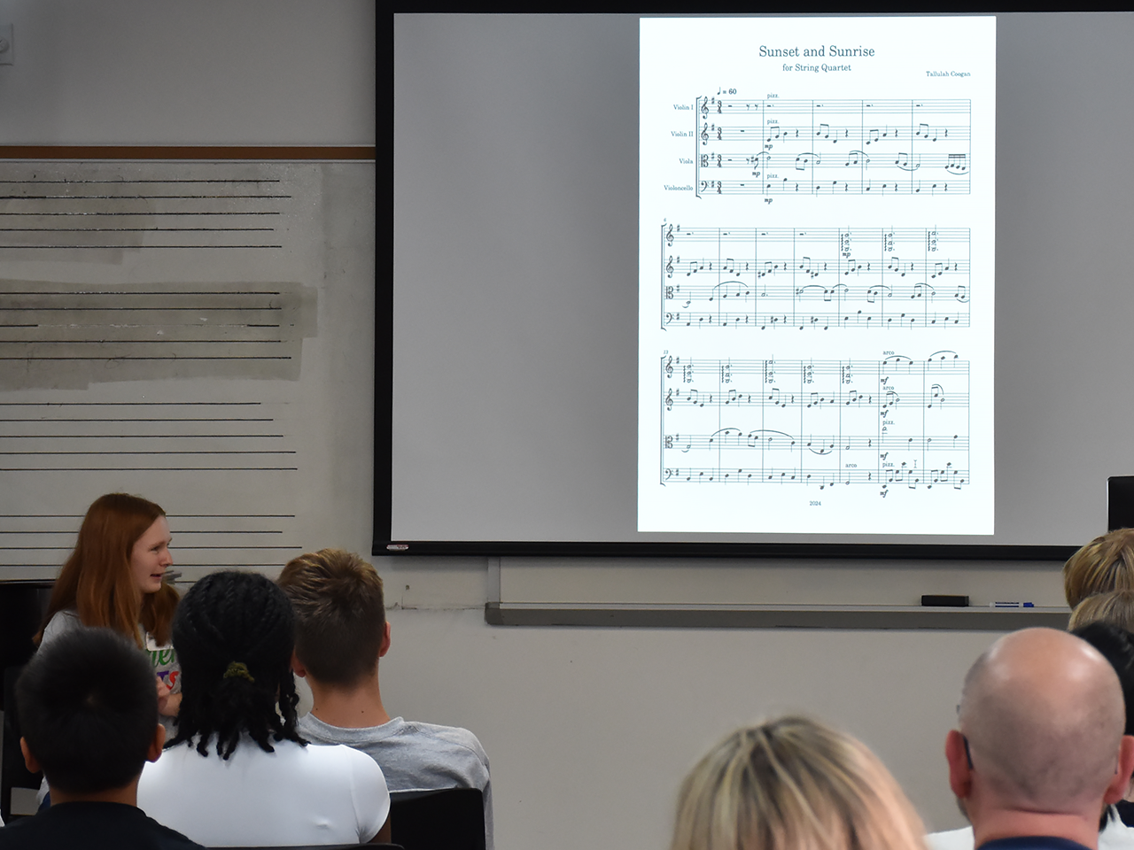 a student showcasing her final composition piece