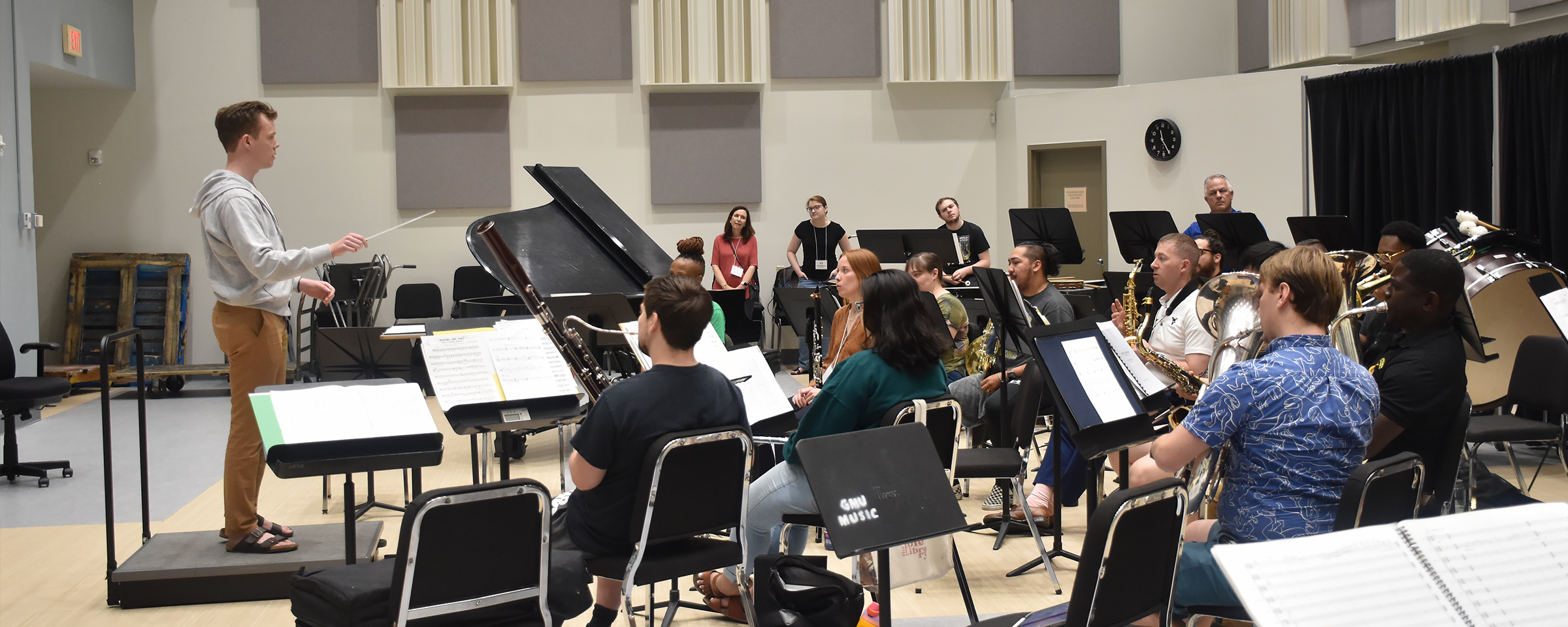 participant conducts on stage